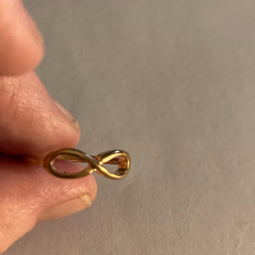 Gold infinity design ring. Costume jewelry